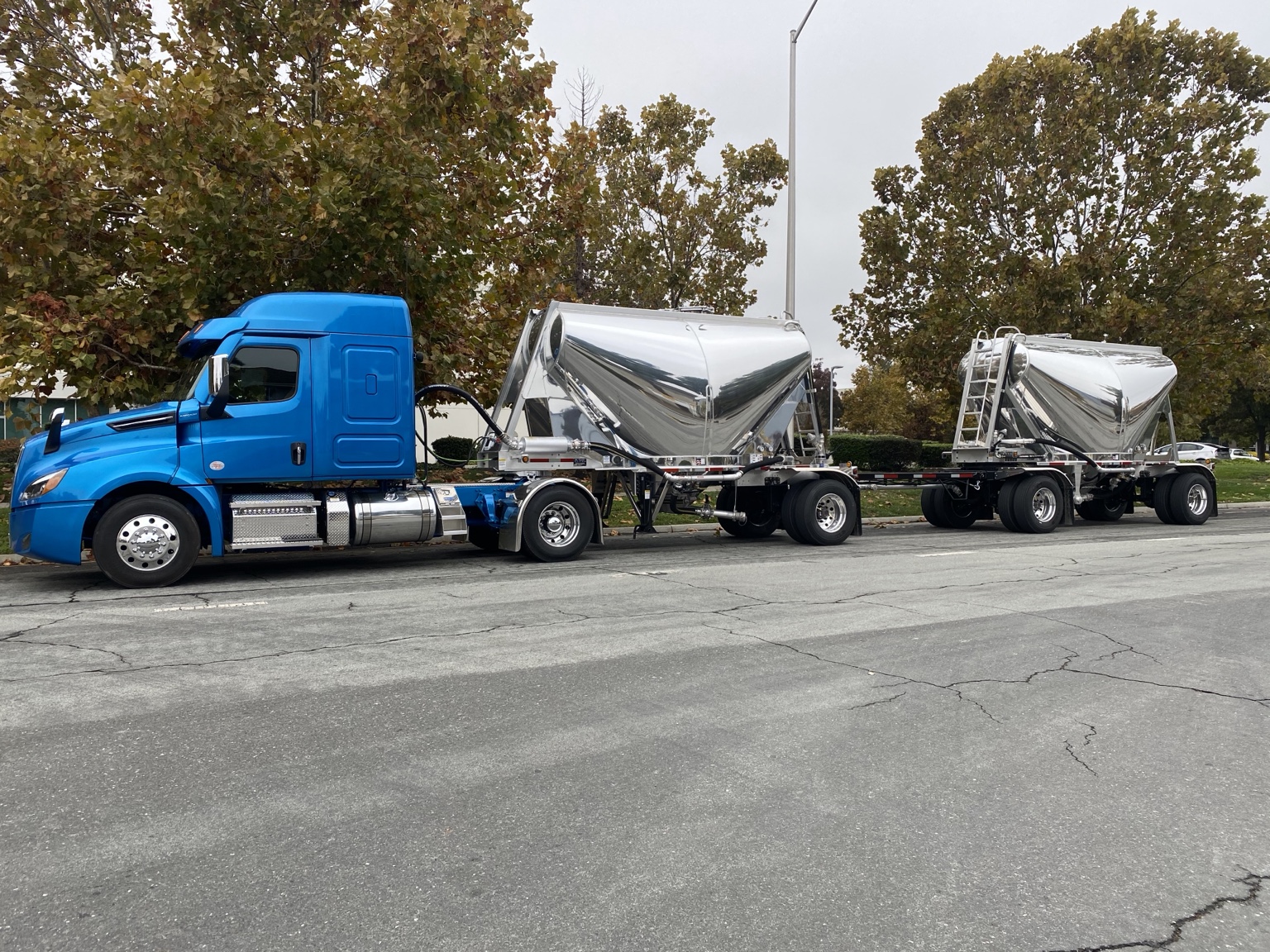 Blue United Bulk tractor with polished double pneumatic trailers